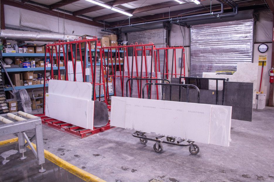 The production staging area uses a fleet of red Hercules carts. 