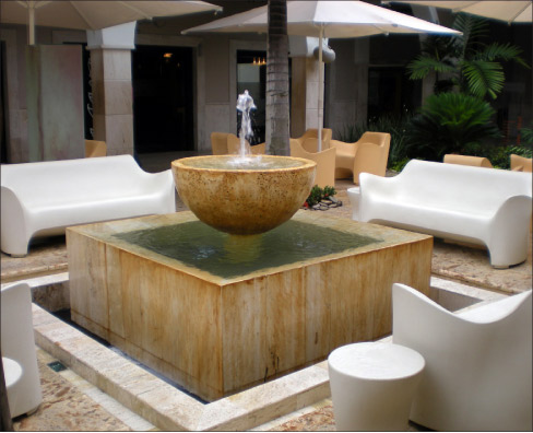 Travertine, despite its porous texture, is a limestone and has been used in fountains for centuries. So, depending on the subflooring (like concrete), a travertine floor won’t be damaged by a little water.