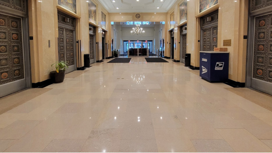 Cleaned, restored and polished, the Jerusalem Gold limestone lobby floor still looks pristine after a month of use — especially now, with regular maintenance.