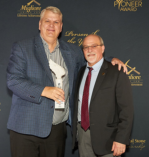 Ernie van Etten (left) receives the inaugural Spirit of Service Award