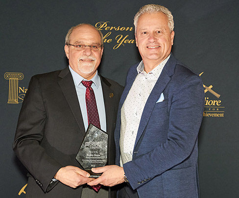 Buddy Ontra (right) of Ontra Stone was named NSI’s Person of the Year at the recent 2023 TISE Show.