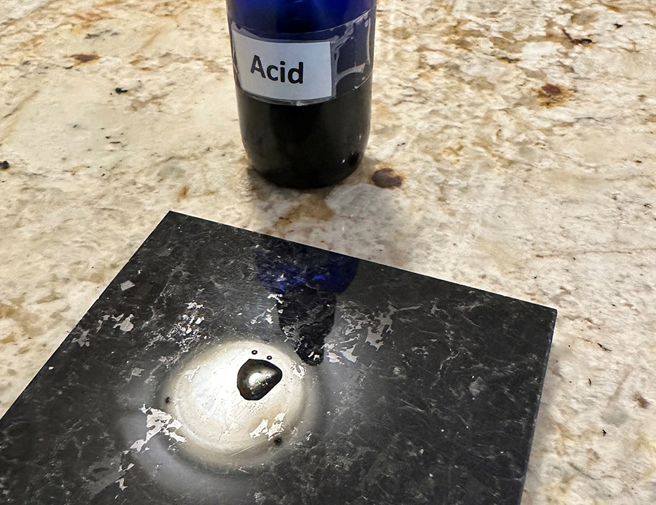 Marble, a stone containing calcium, reacts to application of an acid.  