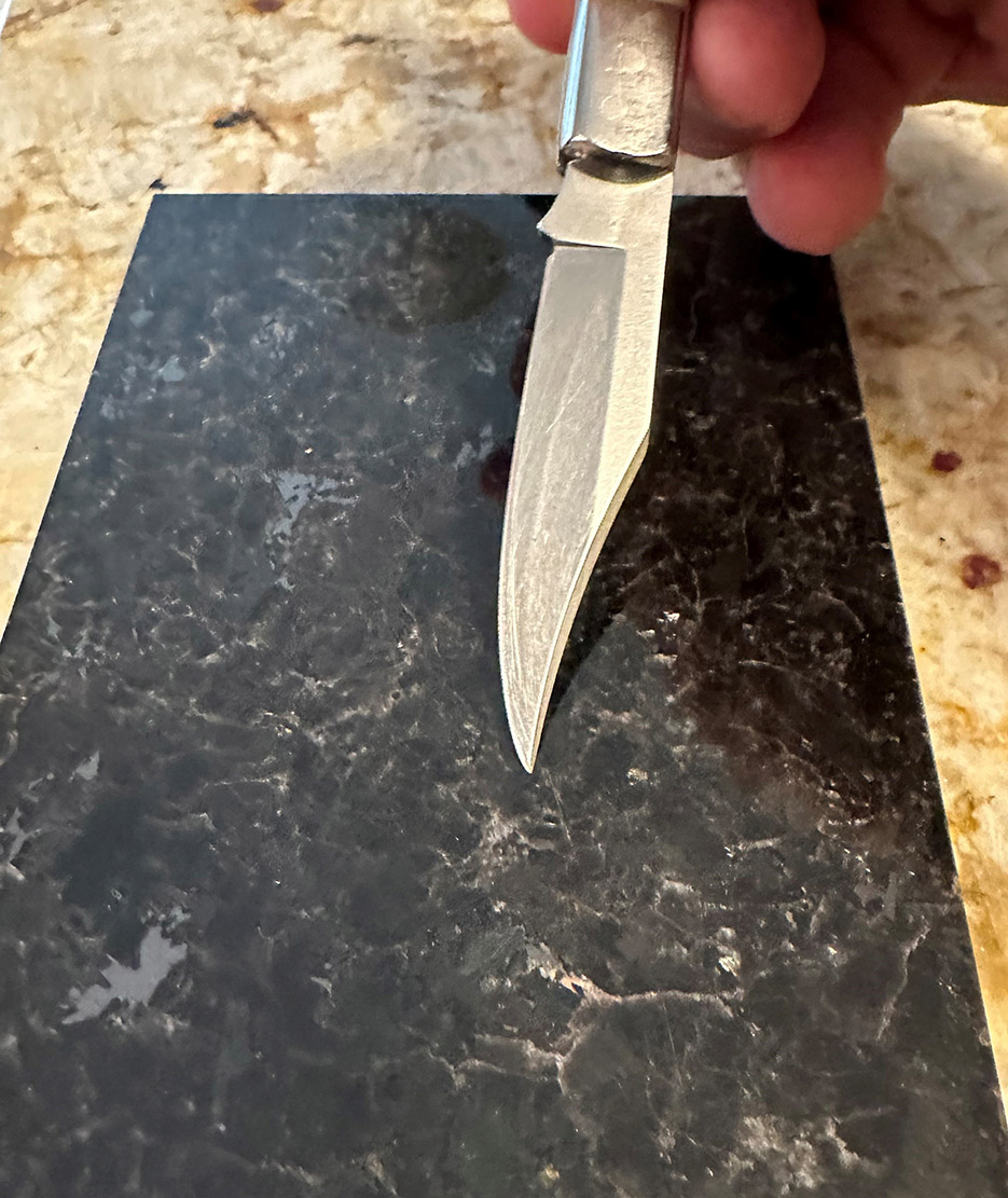 On the Mohs scale, most granite is harder than a knife blade, so the typical granite will not be scratched by a knife point.