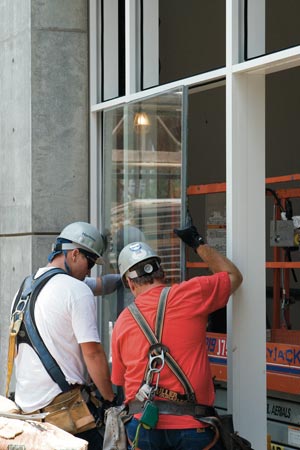 At the High Museum of Art in Atlanta, GA, this insulating glass unit will rest on resilient, permanent shims called setting blocks and be centered in its frame by edge blocks. Temporary shims may be used to hold the unit tight against the interior gasket while the exterior gasket is applied.  Photo courtesy Glass Magazine, a publication of the National Glass Association (NGA)