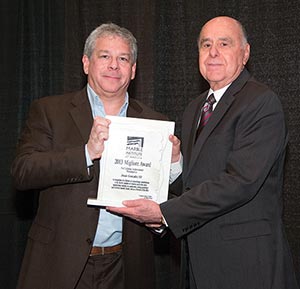 Jesús González III (right) of Marble World receives his Migliore Award for Lifetime Achievement from the 2013 MIA President Jonathan Zanger of Walker Zanger.