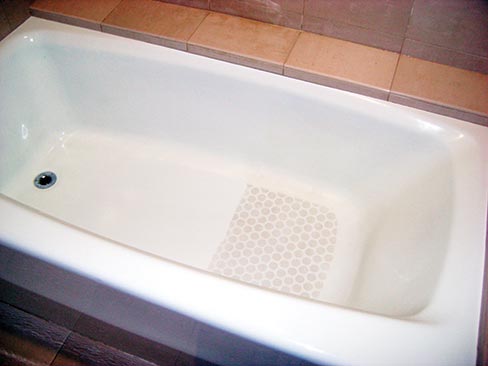 A sample soft-blast bathtub, about one-half completed. “We do this for the managers as a sample to show the difference, not only to show how clean and sanitized it looks, but the kicker is the bottom is now 400% above all A.S.T.M. and ADA, and OSHA standards and never goes away. We do this portably with our blast vac machines I invented, as with the perfect amount of pressure and the perfect amount of vacuum with our special blasting materials makes for a perfect smooth safe finish. We do each bathtub in about 10 minuets, only to hotels 300 rooms and up. We just completed the St. Francis Hotel Westin in San Francisco, California, and saved them millions in replacement for a fraction of the cost.”