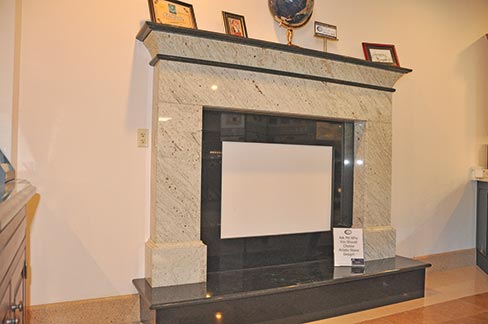 Meticulous attention to detail makes this showroom fireplace surround a showpiece, featuring Ambrosia White granite with Absolute Black inner surround, hearth and accents. “The great thing about this business is that we make everything in a house look good with our stonework,” said Jon.