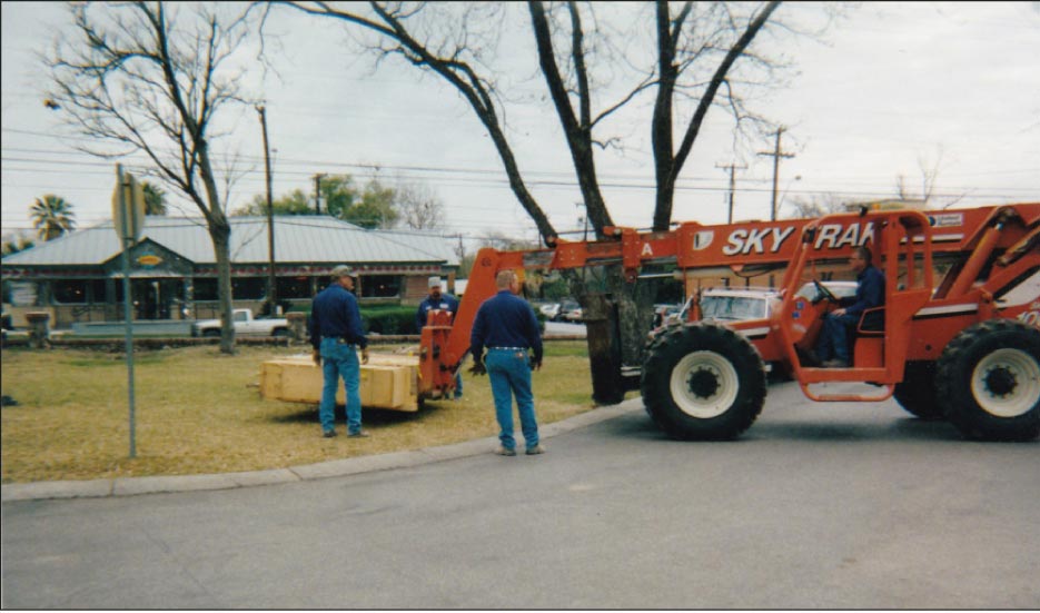 Step 1: Using a 10,000-pound capacity SKYTRAK to lift the crated top off the ground.