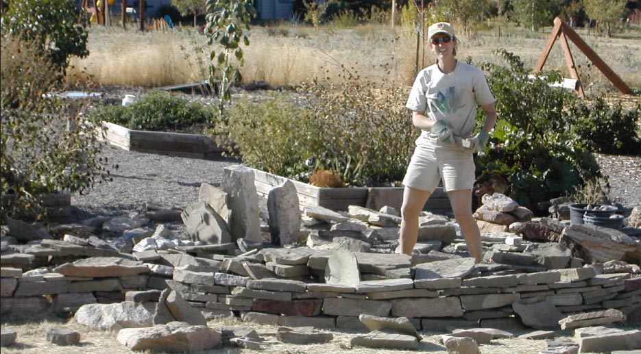 Kirk hand-selects stone to dry stack her Wall of Time.