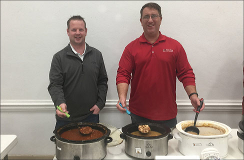 Left to right: Braxton-Bragg employees Jeff Dykstra and TJ Johnson serve soup at the Empty Bowl Fundraiser to end veteran homelessness. 