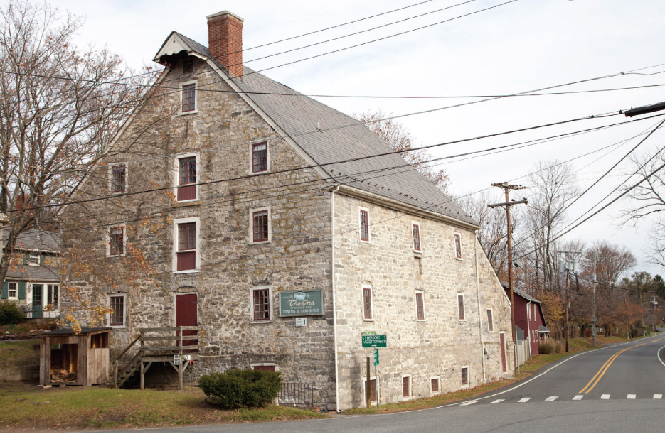 Above and Below: Designed by Christian Christianson (the designer of the Bethlehem Pennsylvania waterworks) and constructed in 1770 by master mason Philip Maixel and carpenter Joseph Grotz, the grist mill was the first of many structures to be made from locally quarried rough-cut limestone. This renovated structure (below, adding a new slate roof) was made into a bed and breakfast in 1986 and is currently The Inn at Millrace Pond. Records show that the mill provided flour to General George Washington’s Continental army, while based at nearby Jockey Hollow, New Jersey.