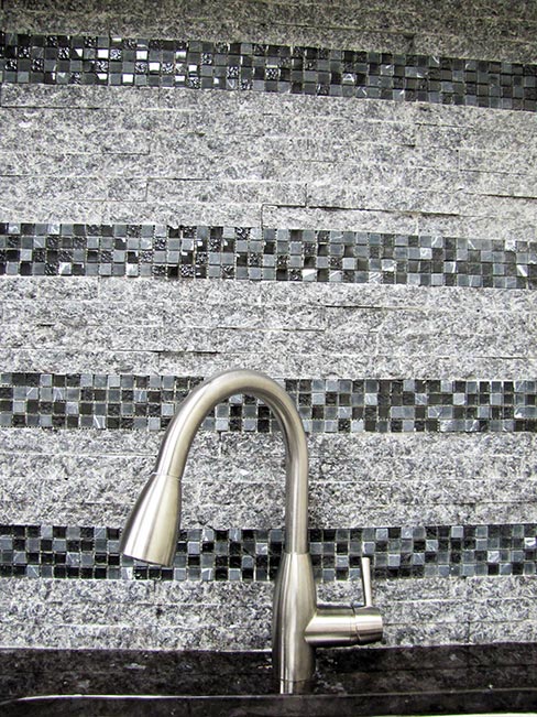 This stunning combination of split-face granite and glass mosaic tile is made easy and possible with the Tomahawk Stone Splitter, which will turn your scrap granite into recycled gold. Look for a story next month on making your own split-face creations with the Tomahawk.