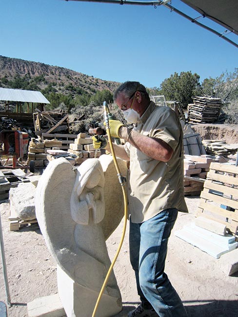 Student Patrick Halloran working on a free-standing angel monument in the 2013 class.