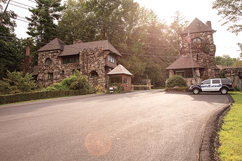 The gate house; the first structure of the Tuxedo Park Club in Tuxedo, NY. “I think the Tuxedo Park Club was the very first gated community in the U.S.,” explained Michael. “The stone fence extends only to the close left and close right of the gate and not around the whole park. To the right, the fence ends and the mountain makes its own natural boundary.”