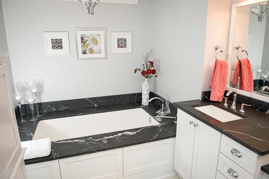 Negro Marquina marble vanity & tub surround creates a classic spa-elegant space.