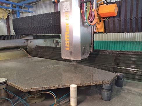 Löffler LBZ Dual Bed CNC Router boasts a two minute change-over time between CNC cycles. One setup can be loaded while another is in the center table being edged, and sinks being routed, making it a very efficient machine for a busy shop.