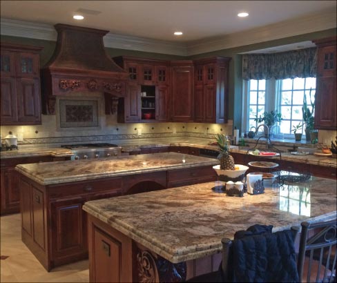 Double granite island kitchen by Ellis Stone. Many of his jobs are in a resort town full of luxury properties, near Salt Lake City.