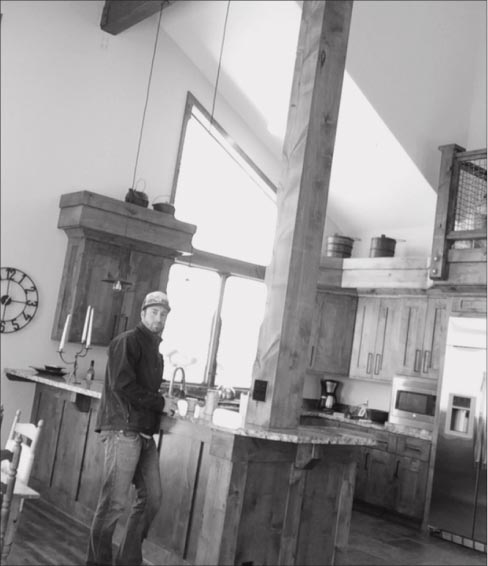 Custom kitchen with chiseled counters and stainless farmhouse sink.  Ellis does most of his fabrication work using a Park Cougar bridge saw, a single speed router, and hand tools and polishing pads from Braxton-Bragg.