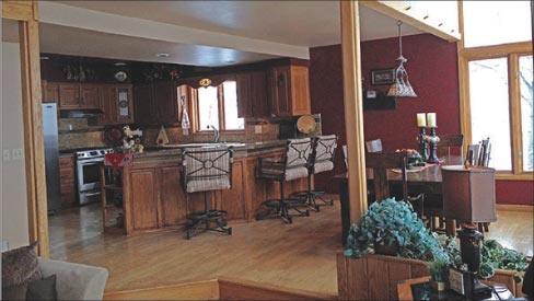 Before: the kitchen of this vacation home is a dark and cramped work space.