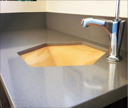 Custom hexagon undermount vanity sink in quartz, with matching backsplash and modern fixtures