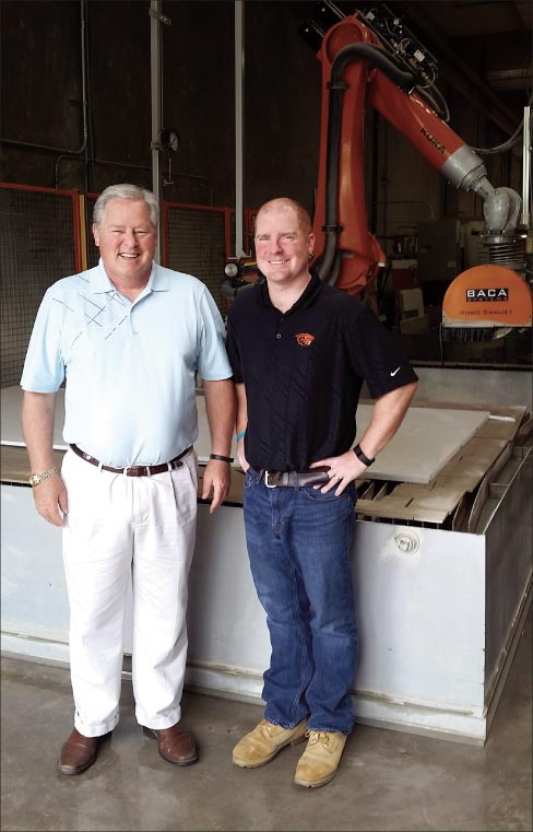 Left to right: Michael Twiss, Owner of Natural Stone Designs, and Jeremy Twiss, General Manager. Behind them is their BACA Robo SawJet, which has revolutionized production in their shop.