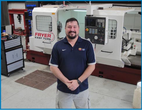 Matt Wilson in the Wilson Industrial Electric machine shop, in front of their CNC lathe. Wilson builds all its machines in-house, with an in-house R & D department to develop new software and technology.