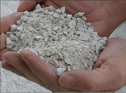 Pulverized porcelain refuse ready for recycling into new ceramic tile products.