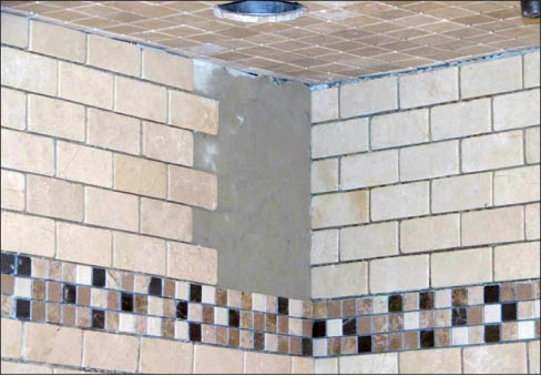 Tiles with resin-coated back are a failure waiting to happen in vertical installations – just say no! Instead, use fiberglass-backed tiles for safety and peace of mind.