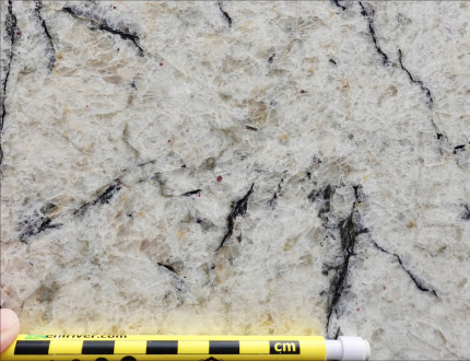 This granite features black bands of mica – beautiful, but because mica is softer than the surrounding crystals, it can be challenging to fabricate.