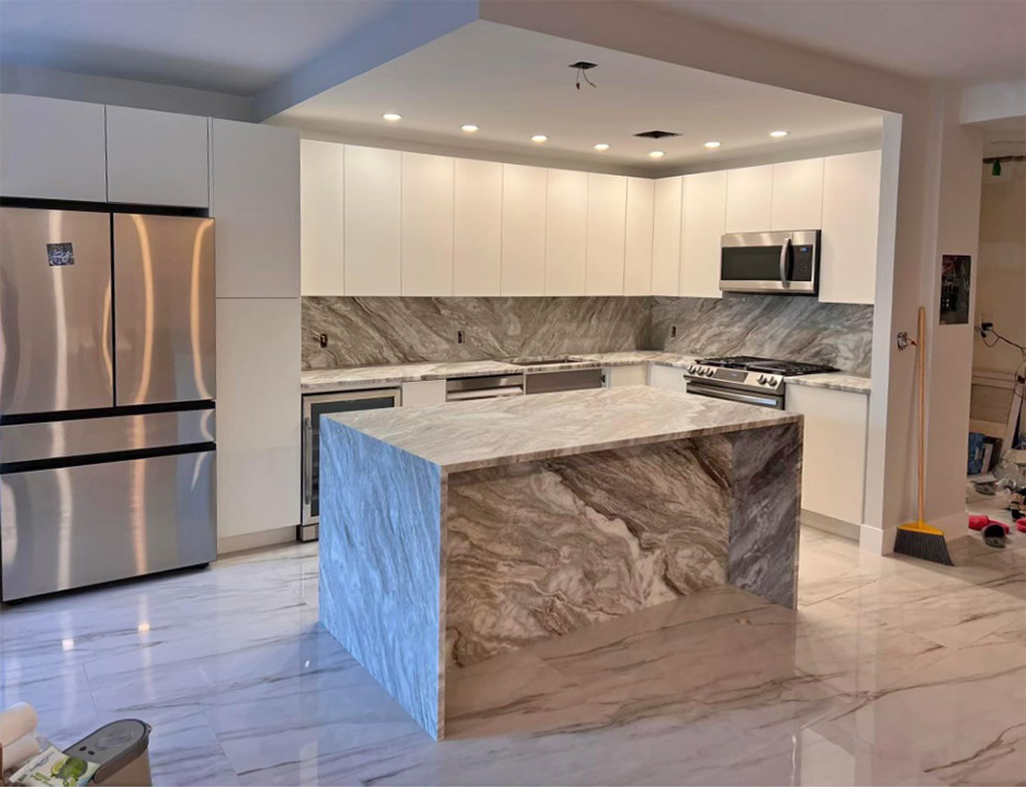 Mitered islands and full-height backsplashes are popular choices in the upscale New  York kitchens produced for Luxury Marble and Granite’s customers.