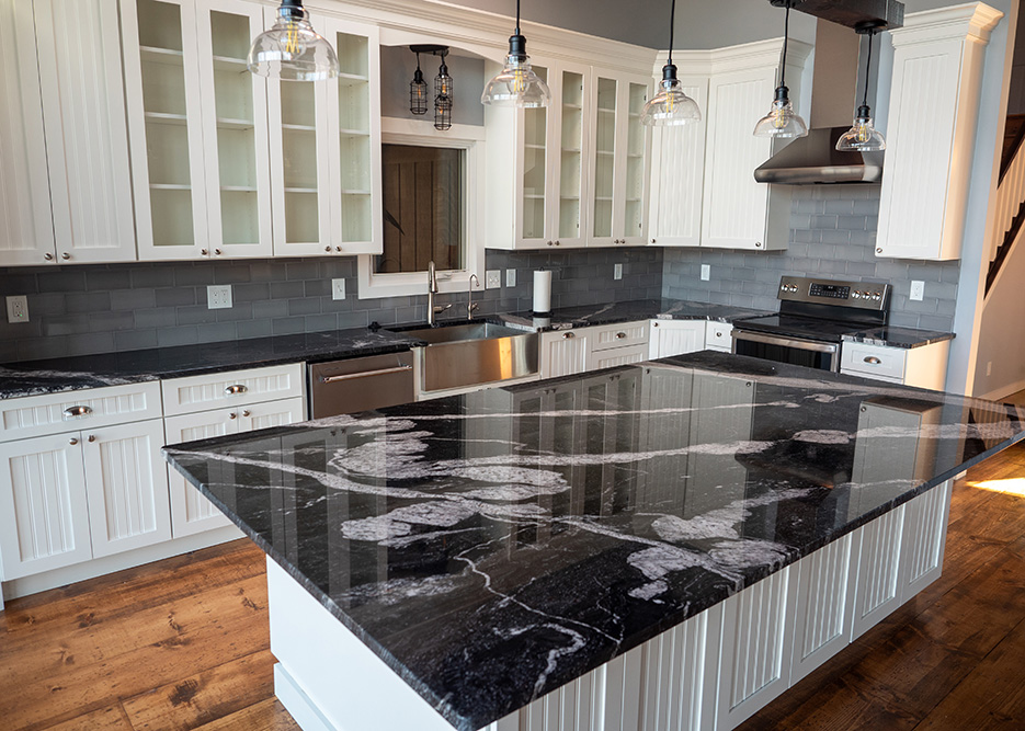 White Horse granite kitchen for builder partner Petros Homes features a stunning, one-of-a-kind island.