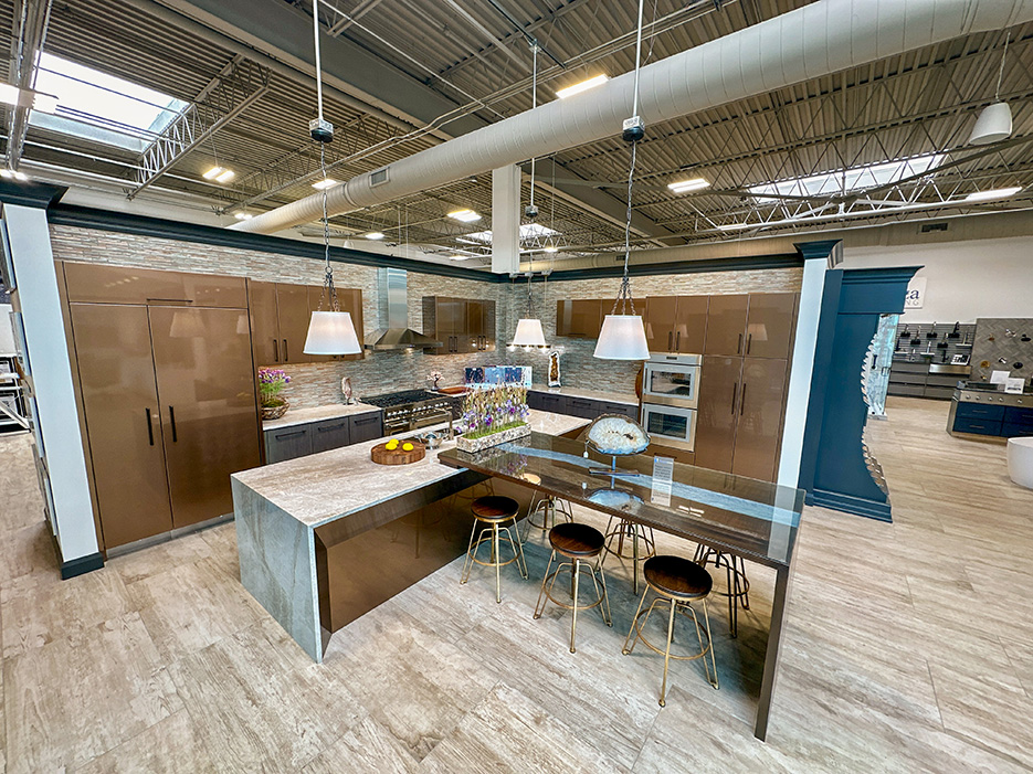 Kitchen vignette in the spacious Firenza Stone showroom. Their headquarters includes a 30,000 square foot climate-controlled gallery housing slabs and samples, and an 18,000 square foot fabrication facility.