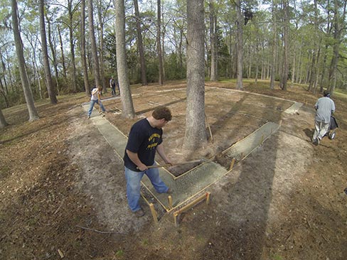 With forms directly above the old foundation, crushed limestone was used as a base before pouring the concrete. Most of the original foundations throughout the park lay 2-3 feet below the surface. 