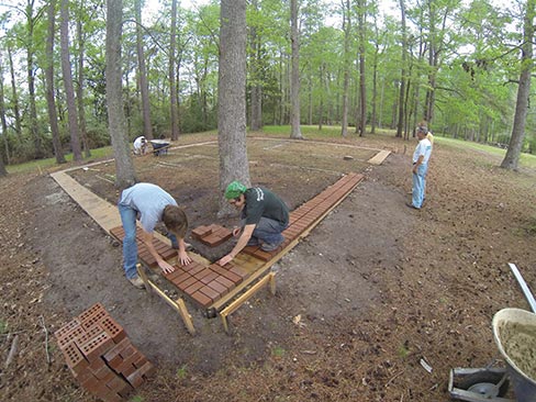 With forms directly above the old foundation, crushed limestone was used as a base before pouring the concrete. Most of the original foundations throughout the park lay 2-3 feet below the surface.