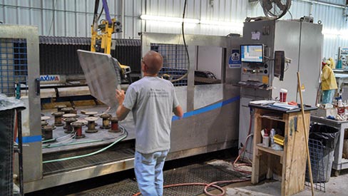  Second-shift supervisor Shawn Brallier uses a Woods Tilter to position a granite work piece onto their CMS Brembana CNC.  B.C. Stone is ideally located to serve several densely populated areas, including Washington D.C., Baltimore, MD, and Harrisburg and State College, PA. 