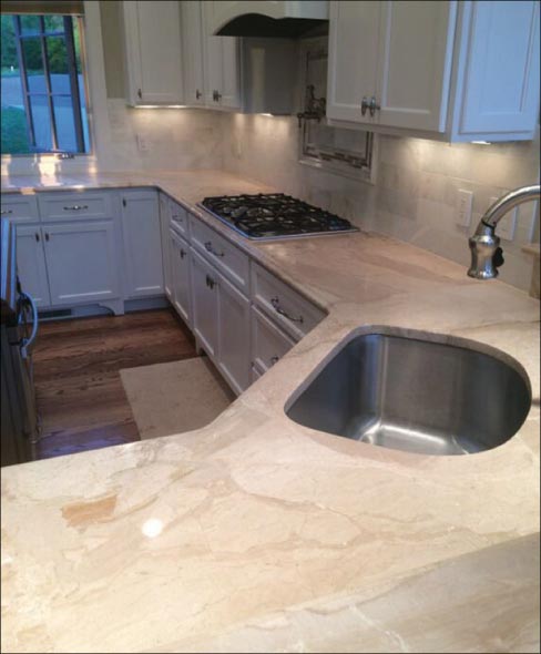 Honed and polished, the sink area of the counter has been restored to its former beauty. After restoring, I recommend applying a quality sealer. Many homeowners will appreciate a little free education in how to better care for their stone investment.