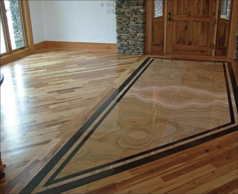 Onyx and absolute black inlaid floor makes a stunning entryway.