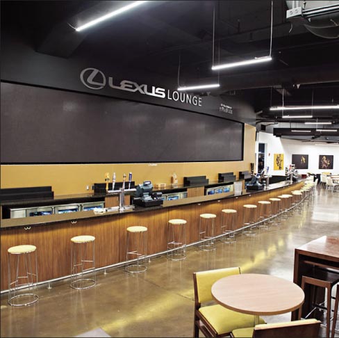 This long, curving bartop at the Lexus Lounge in Bridgestone Arena in Nashville, Tennessee, is formed of Cambria Quartz.