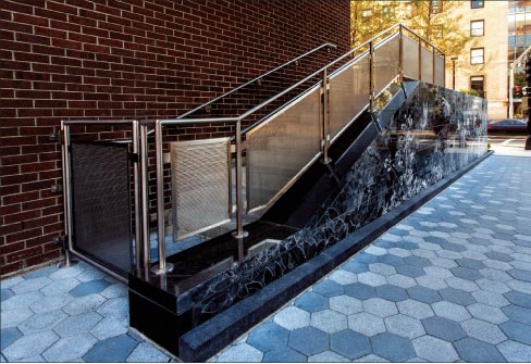 “hide and seek” style wall made of Mesabi Black® granite