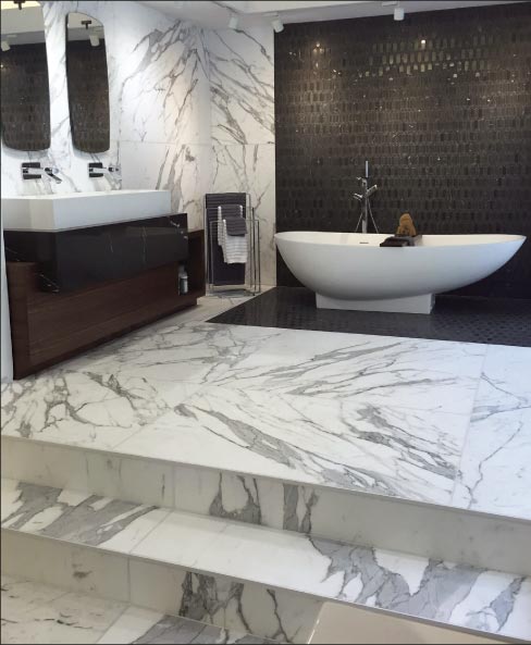 Statuario Marble Think Thin Panels used to create a luxurious space, with a fraction of the structural requirement needed with 2 or 3cm slabs. Cost and ease of installation are also very attractive incentives to offer customers this trend in kitchen and bath design.