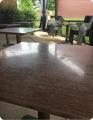 These beautiful but severely etched Tennessee marble café table tops need honing and polishing with 220g, 400g and 800g diamonds, followed with Majestic 5X to restore the finish.