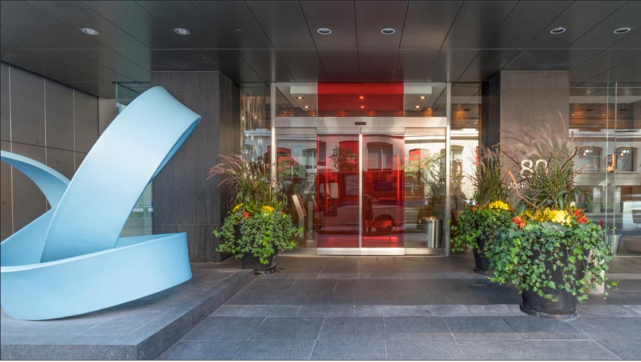 Festival Tower on John Street in Toronto, Ontario features fleuri cut honed Wallace Creek limestone pavers and cladding.