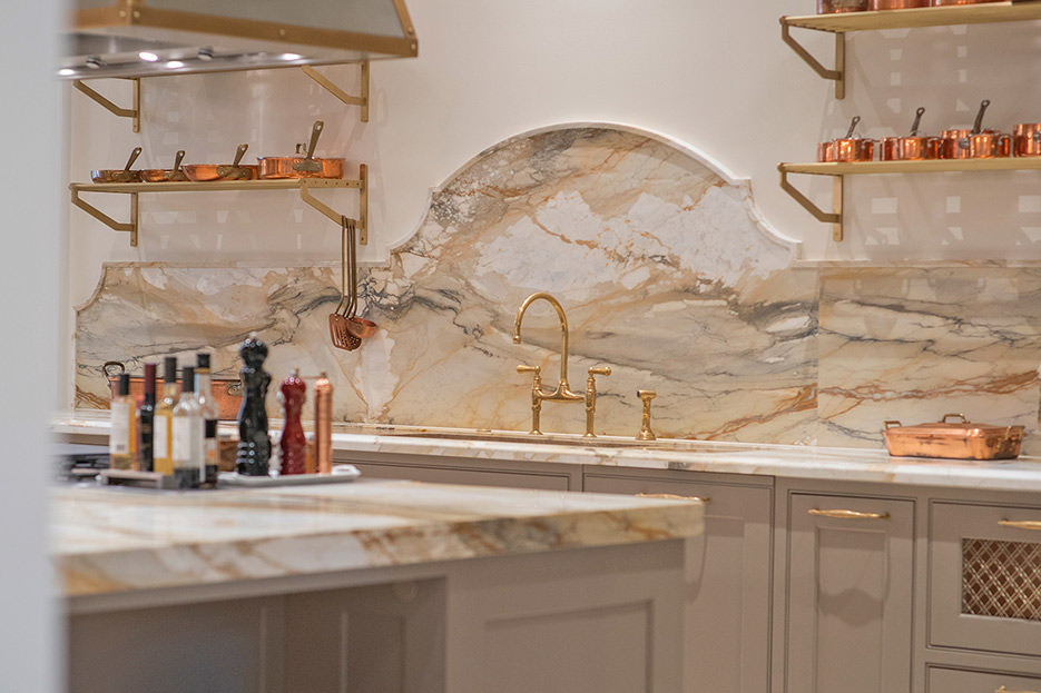 A general view of the Pinnacle Award winning kitchen, with detail on the Calacatta Macchia Vecchia Marble Lux finish countertops, backsplash and drainboard.