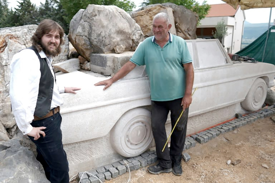 Ivan Topic (right) and sculpture student Fran Marko Vlahinic next to their  creation of a life-sized classic Mercedes.