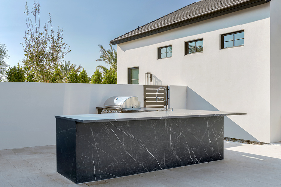 Black Maquina outdoor kitchen countertop and cladding is a durable option.