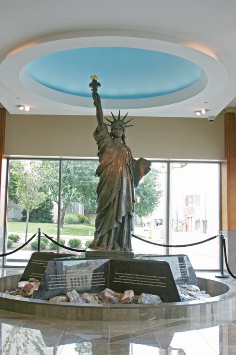 After getting a call to provide marble for several cladding projects at the Chattanooga Liberty Building, Stone Source was tapped to install marble inside and out– and to create a special base for the valuable statue soon to be placed on display: a rare, cast replica of the Statue of Liberty.  3cm Polished Brown antique from Triton Stone was used to clad the statue base, 2 cm Cafe Bruno from Walker Zanger on star-shaped surround, and Georgia Cherokee marble boulders were placed in the fountain for the water to flow over.