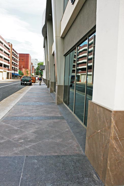 The sidewalk immediately surrounding the Liberty building was laid with some 3,000 square feet of 36˝x36˝ diagonally-set flamed Dakota Mahogany from Cold Springs. Maron Cahiba borders were cut to size by Stone Source from 3 cm slabs that were “flamed “ and supplied by IGM.