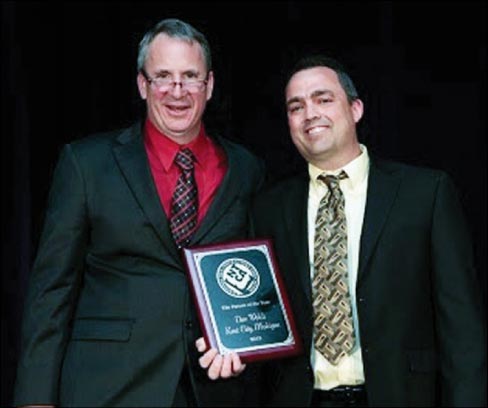 NTCA Executive Director, Bart Bettiga (left) presents Tile Person of the Year Award to Dan Welch of Welch Marble & Tile.