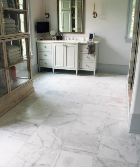 Honed white marble bathroom.