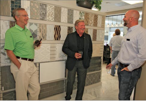 AG&M employees Tim Reid, CFO, Greg Strom, National Marketing Manager and Jesse Bogan, Operations Director enjoying the grand opening reception in the gorgeous AG&M Anaheim showroom.